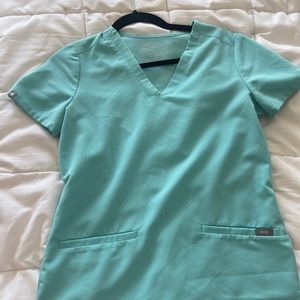 Figs neon blue casma scrub top in XXS